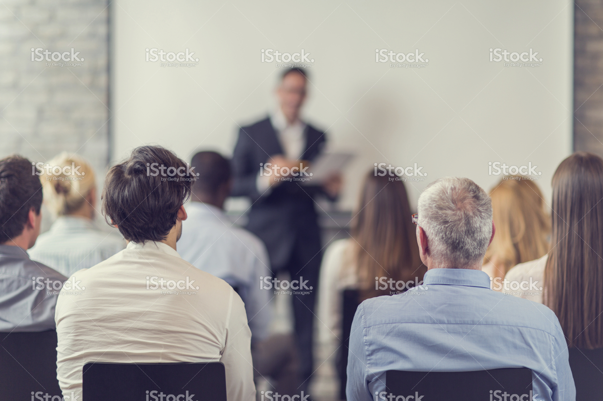 stock-photo-58516610-business-people-attending-a-seminar-